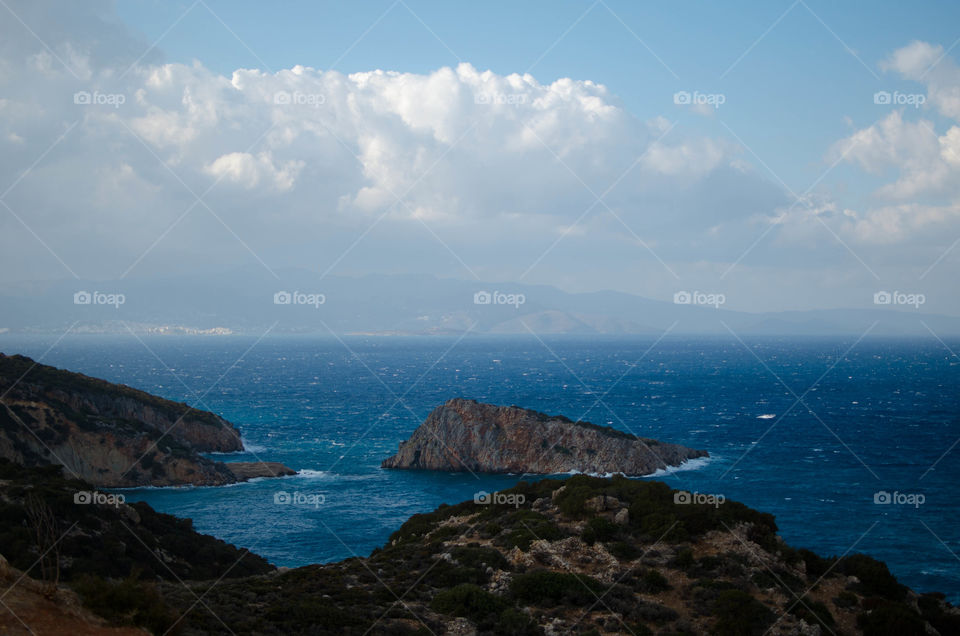 Scenic view of sea against cloudy sky