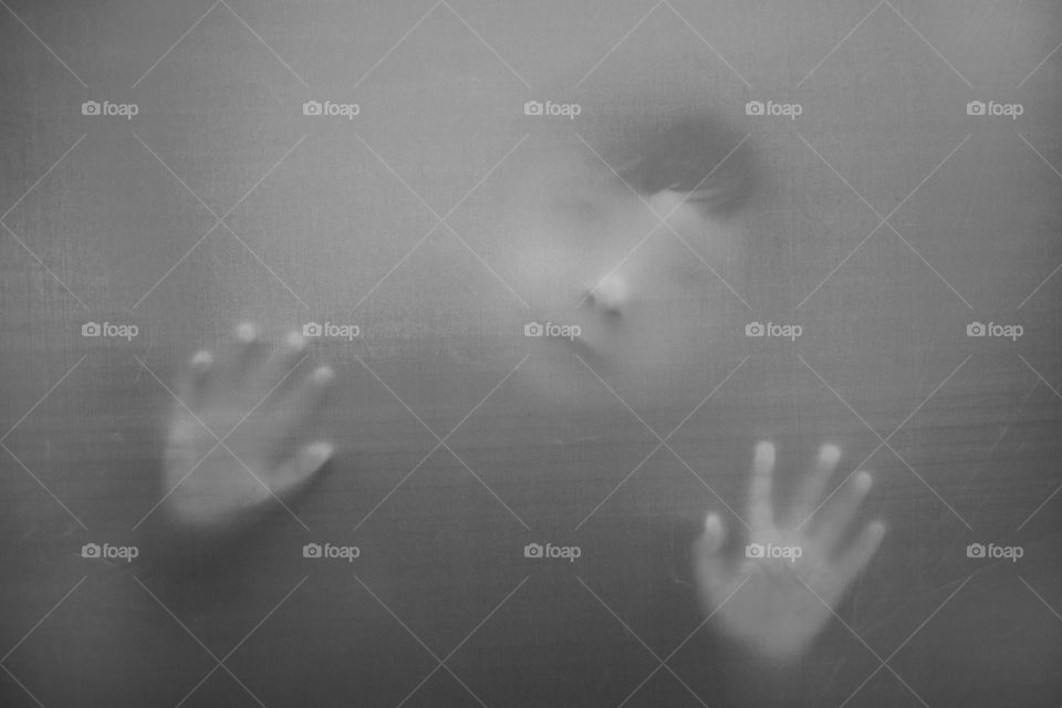 Boy behind the curtain