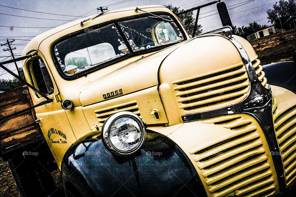 Vintage big yellow truck. It's a classic, it's a workhorse, it's seen better days. 