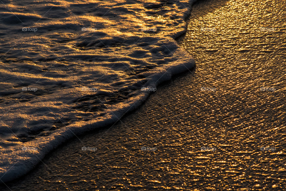 The shape of a wave during sunset time, feel the tranquility and relaxation