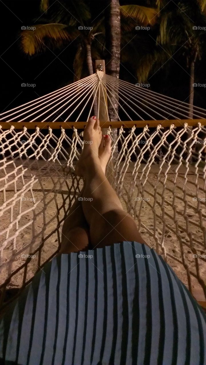 relaxing on a beach hammock