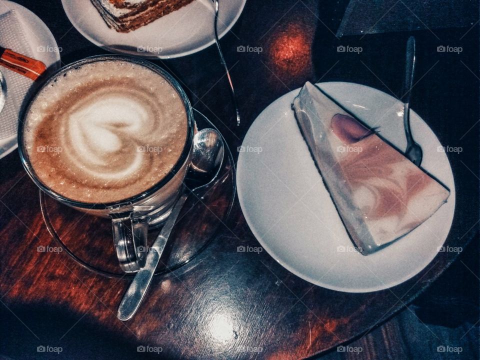 Delicious cheesecake with aromatic coffee Latte