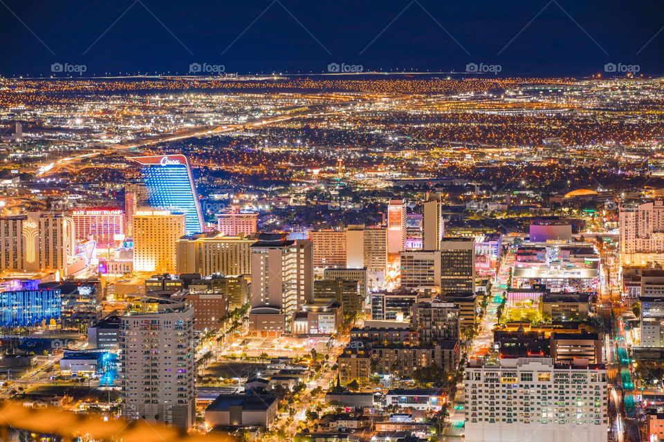 Looking down towards Downtown Las Vegas from the top of the STRAT (formerly the Stratosphere). The nostalgic and historic area of the city now has the brand new Circa, a modern casino hotel. captured at night in long exposure.