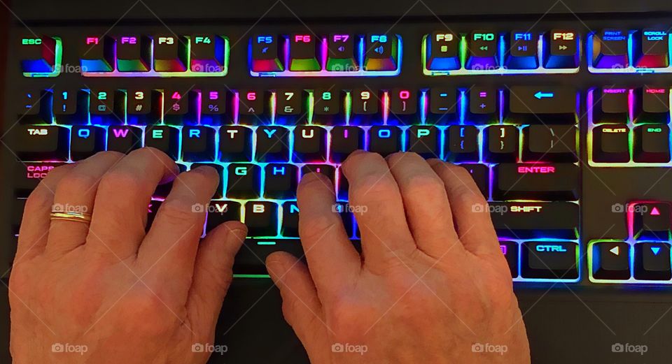 Favorite gadget-Neon colored keys on a computer keyboard.