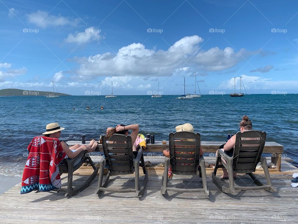 Girlfriends sunbathing on vacation 