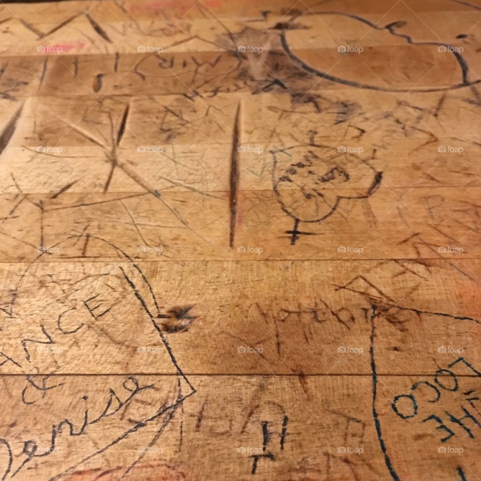 Table graffiti in a coffee shop