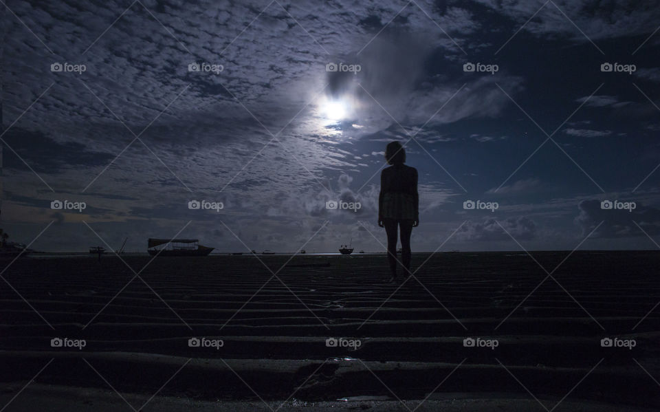 Girl in the beach at night 