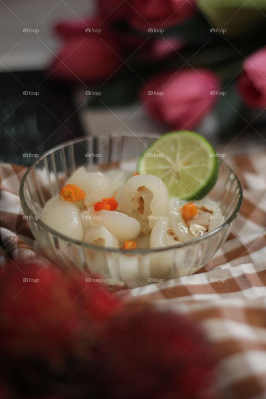 Asinan Rambutan - commonly found in Indonesia. Is a savory snack where the rambutan fruit goes through a pickling process, soaking it in a zesty mixture of salt, sugar, kiamboy, chilli and lime