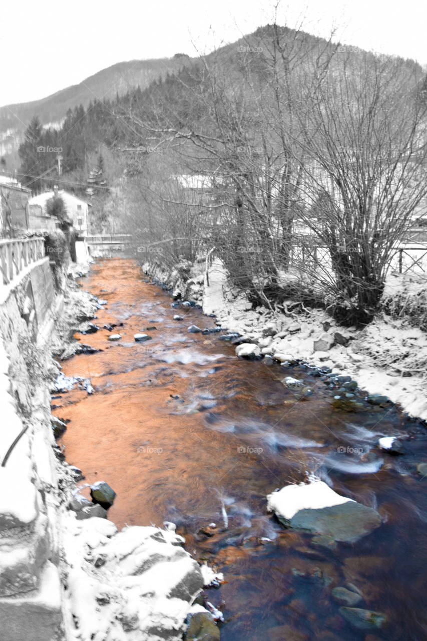 River in the snow of Tuscany