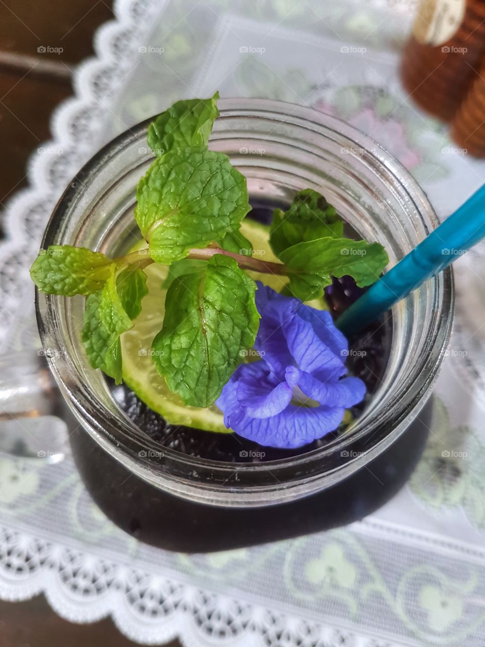 butterfly pea lemonade with fresh mint and flower
