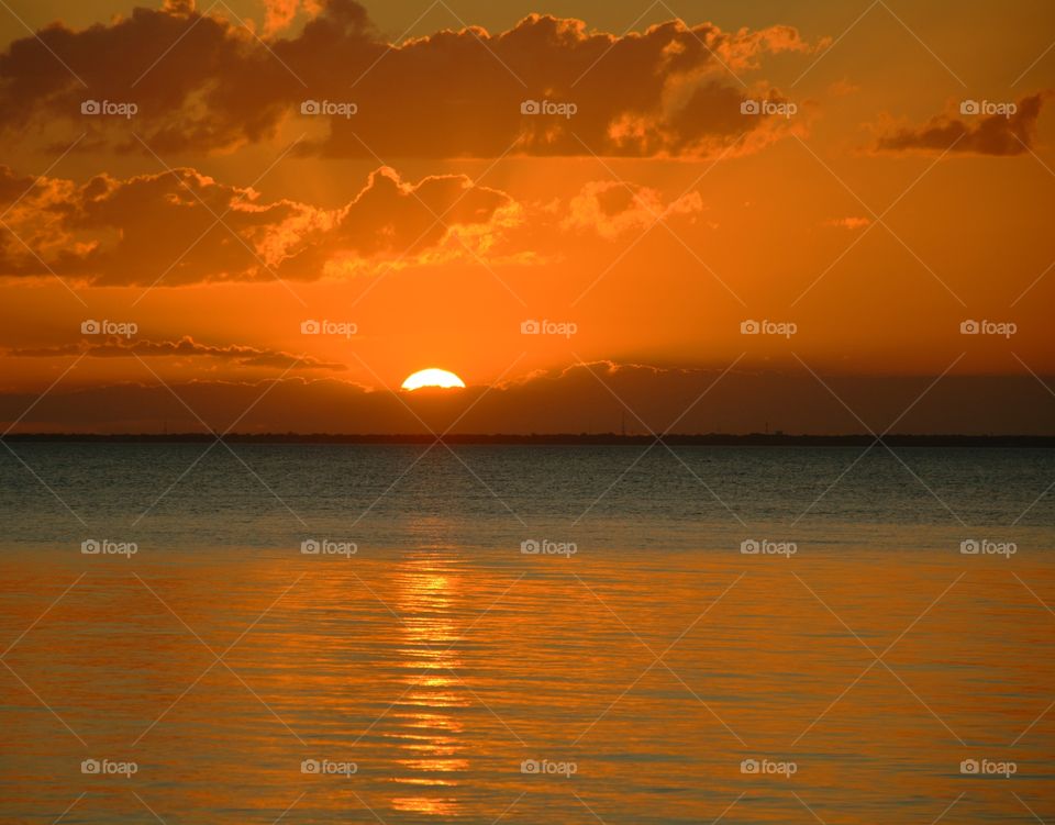 Amazing Silhouettes! The sun is like a great big romantic, inspirational fire in the sky. Brilliant streaks of yellow, orange, gold, overcome the spacious sky. The sky resembled a prism; all the colors blended perfectly together. It's as if the colors and intensity of the light is just right!