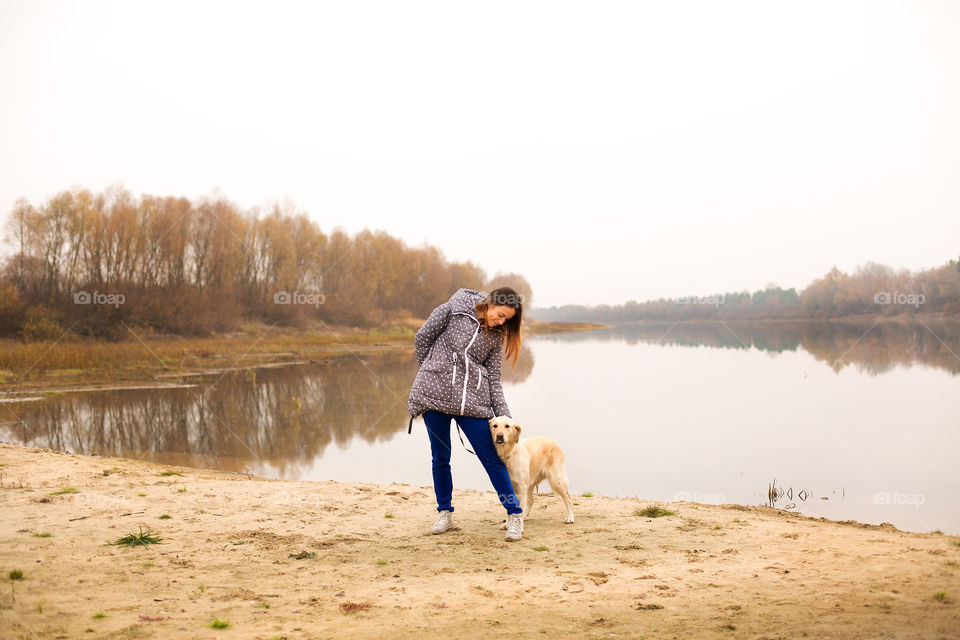 Woman standing with her dog