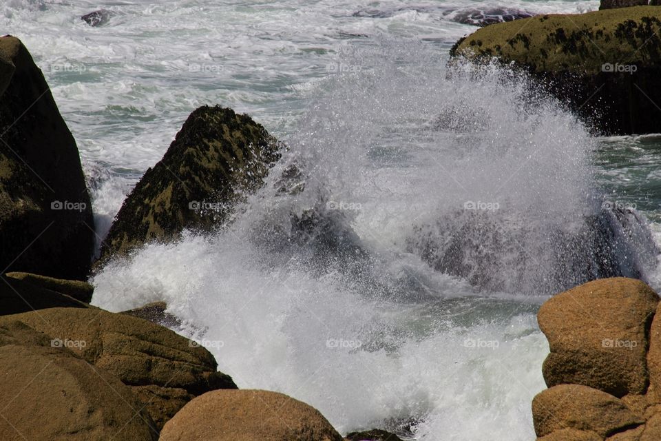 waves crashing on rocks