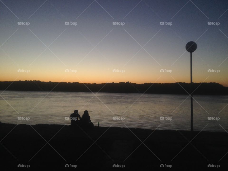 Couple at sunset. Was walking down the sides of the Danube river when i saw this perfect shot opportunity.