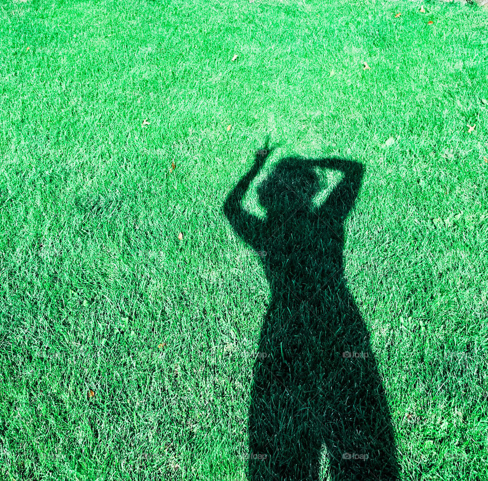 My shadow on green green grass.