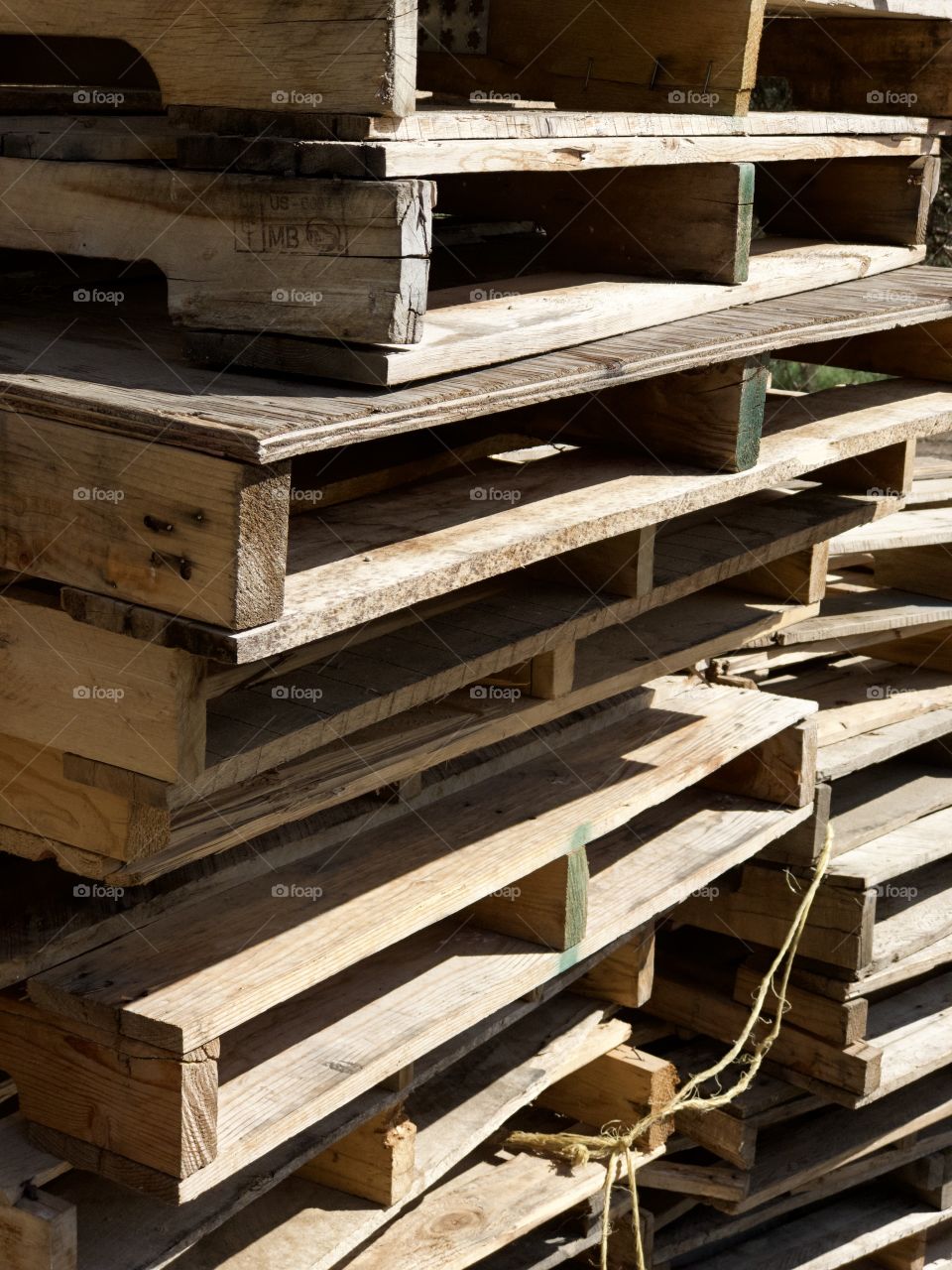 Stacks of wooden pallets waiting for use. 