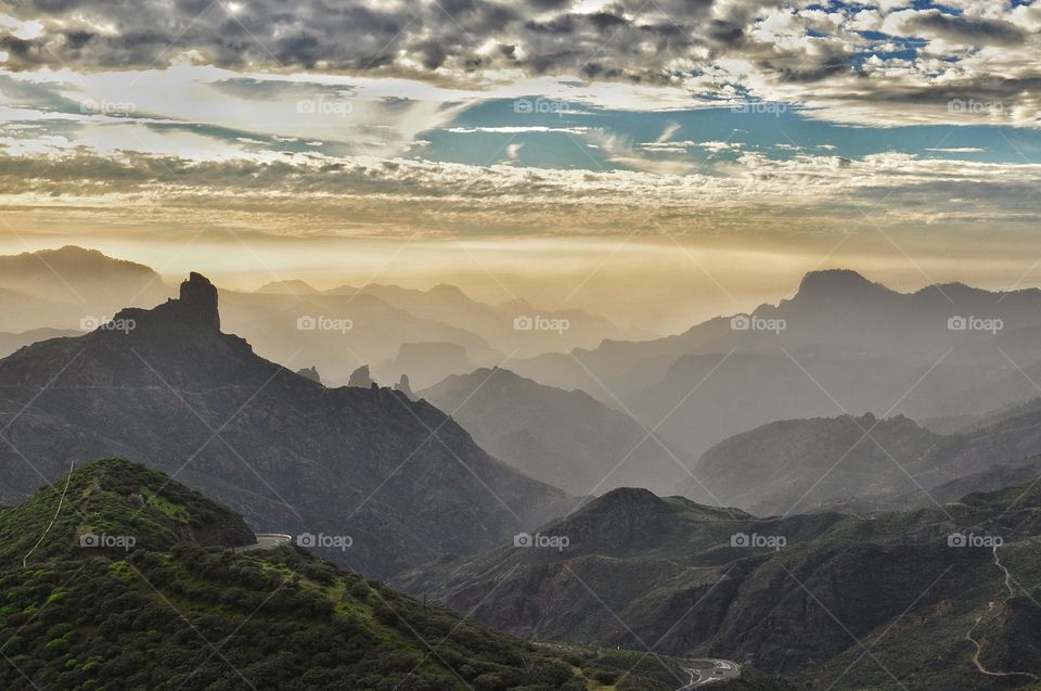 Foggy sunset view over the mountains