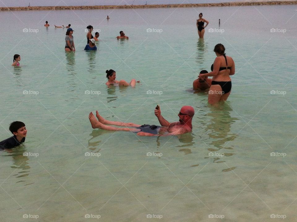 Dead Sea. Floating in the Dead Sea and checking emails