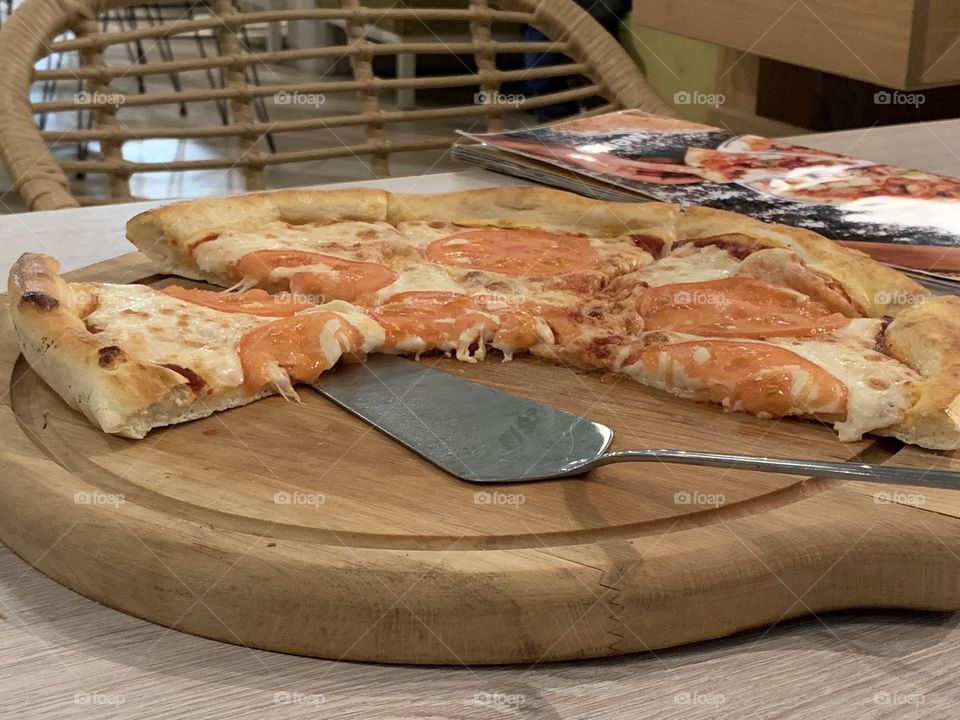 pizza with cheese and tomatoes