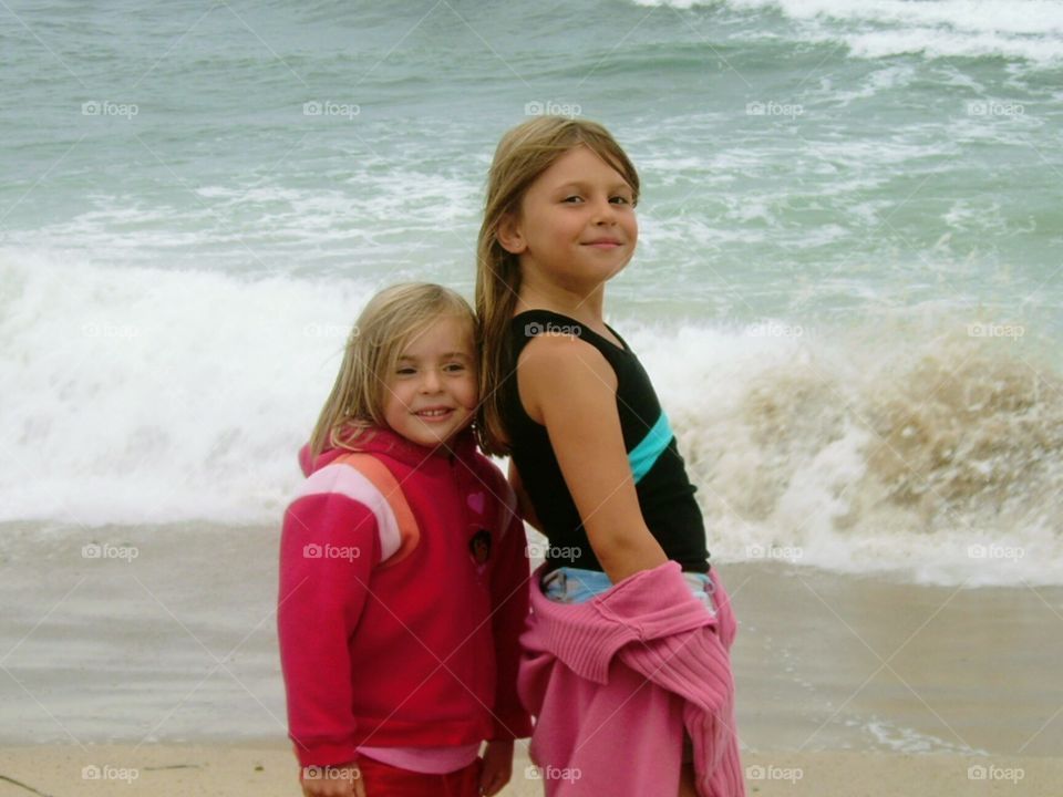 two sisters enjoying a fun day at the beach