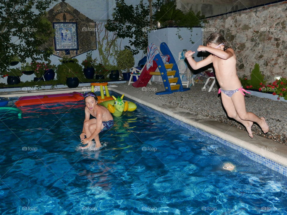 Children playing in the swimming pool