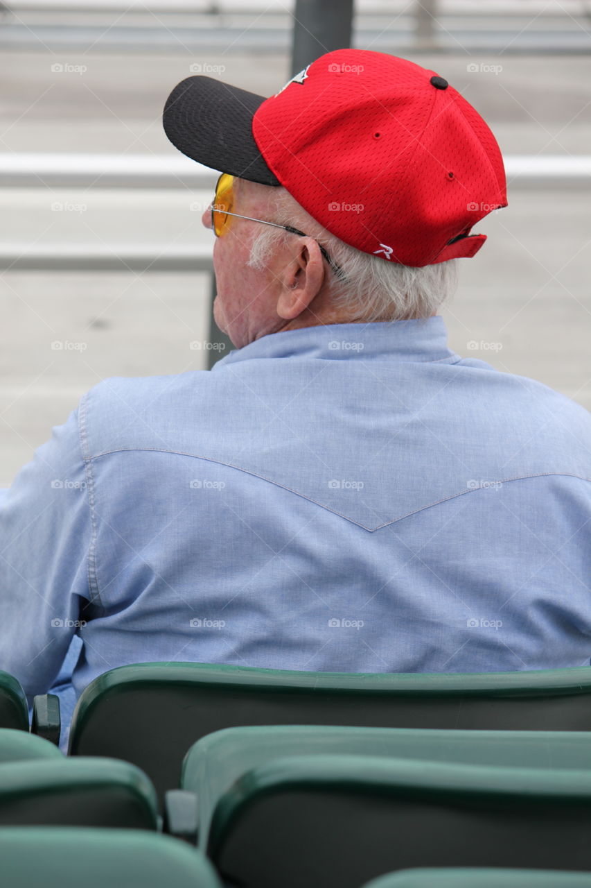 Biggest fan. Grandpa watching 7 on 7 football game