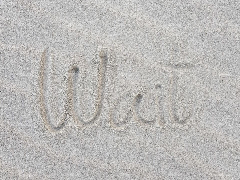Writing on sand beach
