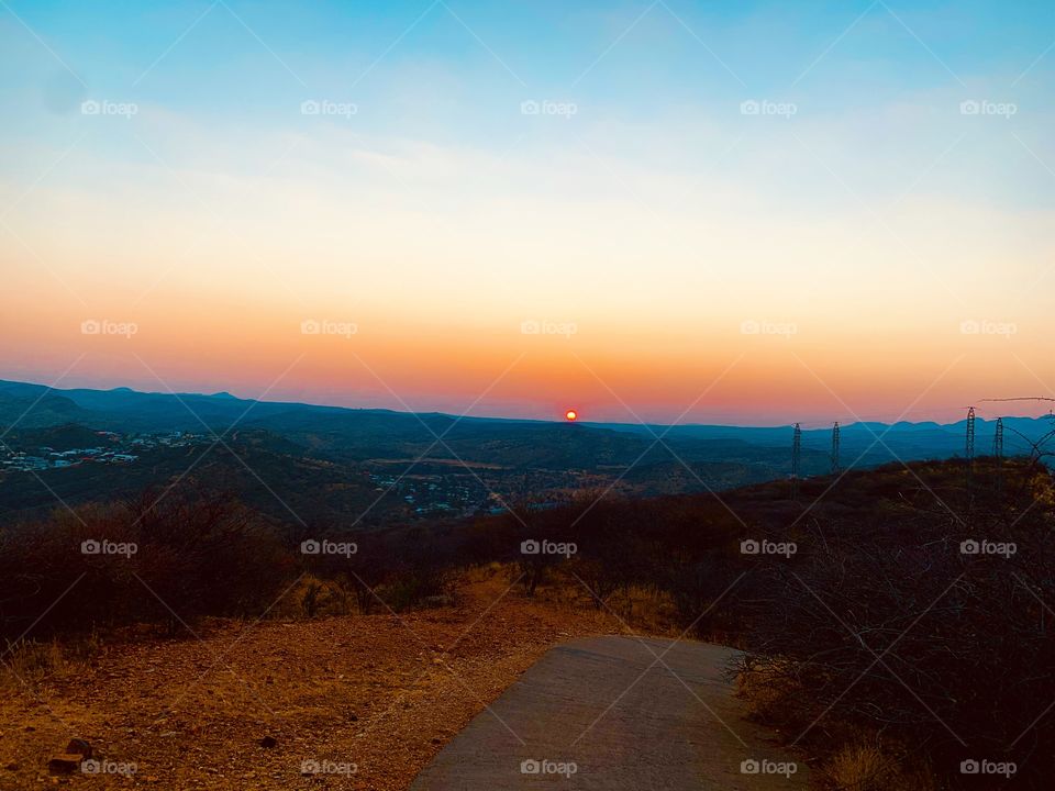 A beautiful view of the sunset over mountains.