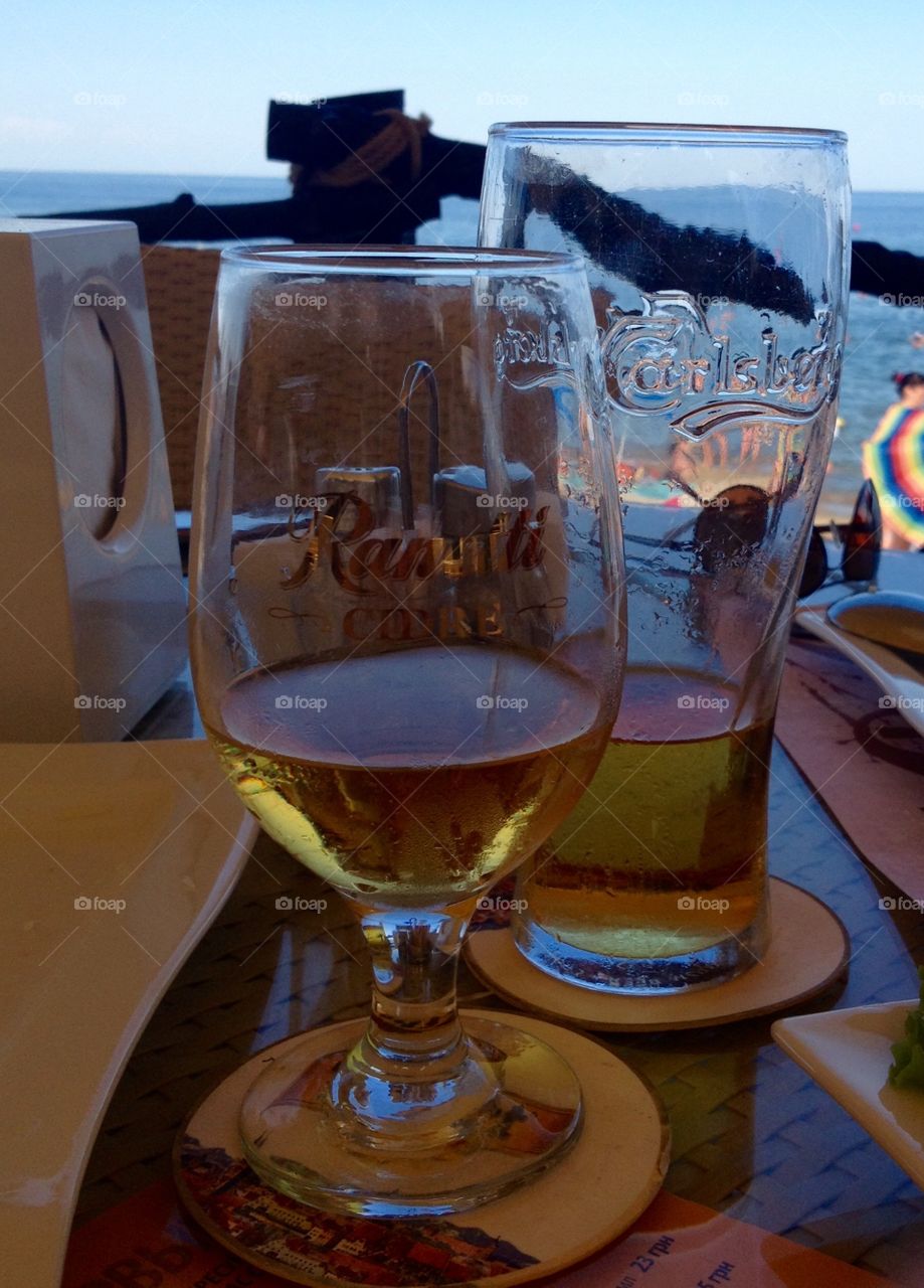 Two glasses with beer on a table