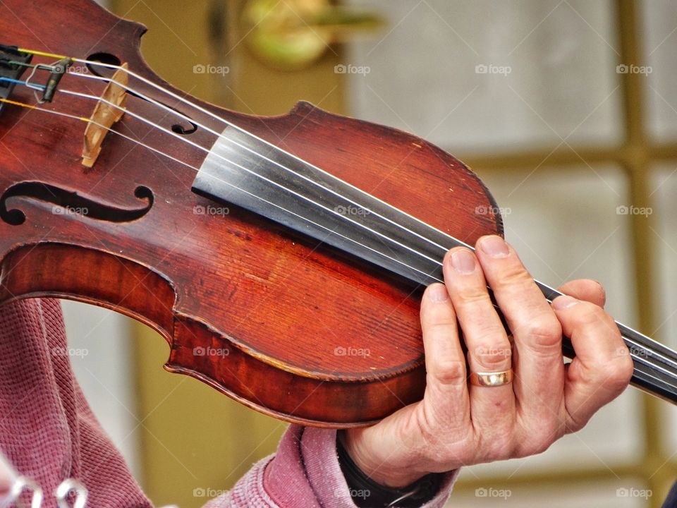 Playing The Violin. Violin Being Played By A Master
