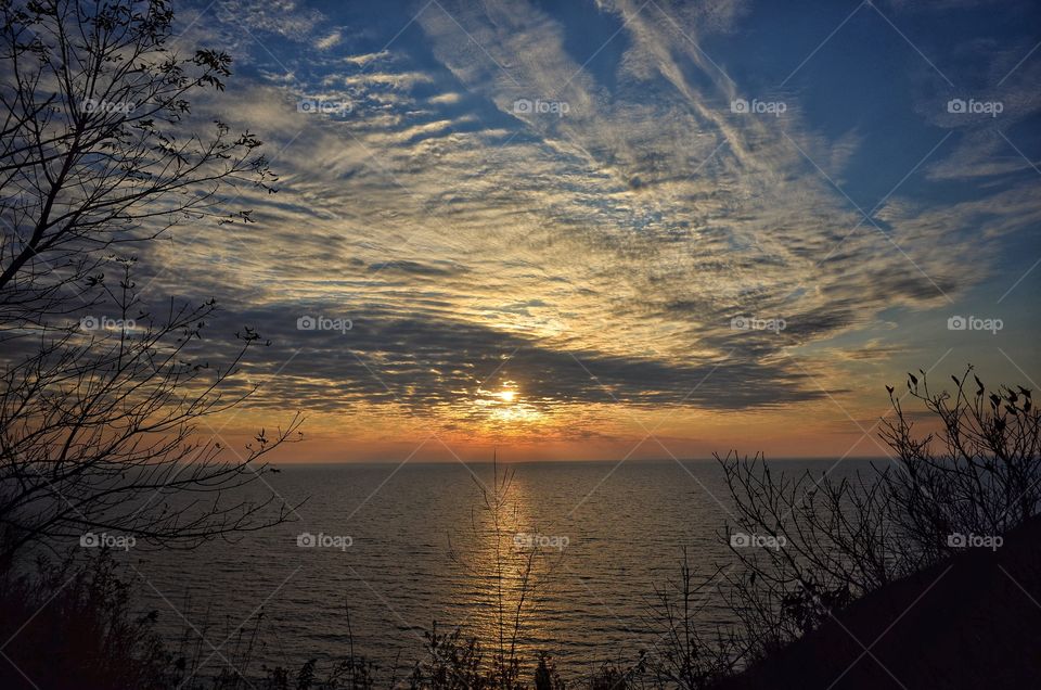 Idyllic view of sea against dramatic clouds