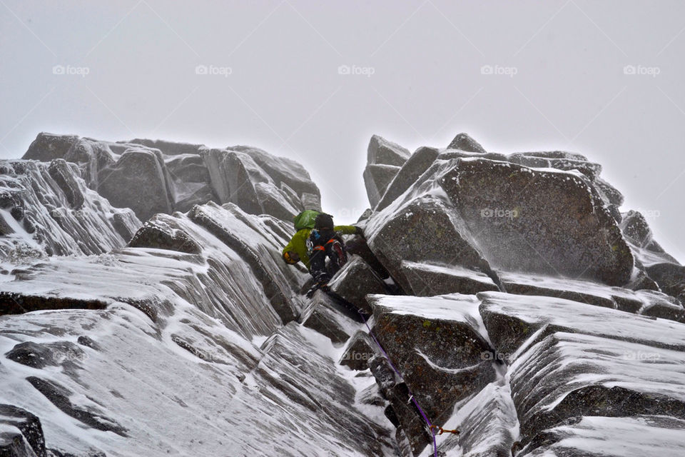 Pulling through the crux of The Seam in Scotland.