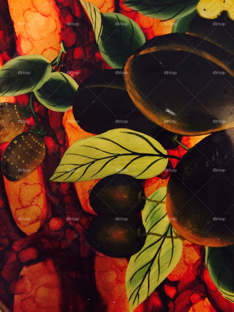 Very colorful pattern with leaves of green, yellow and red colors. Closeup.