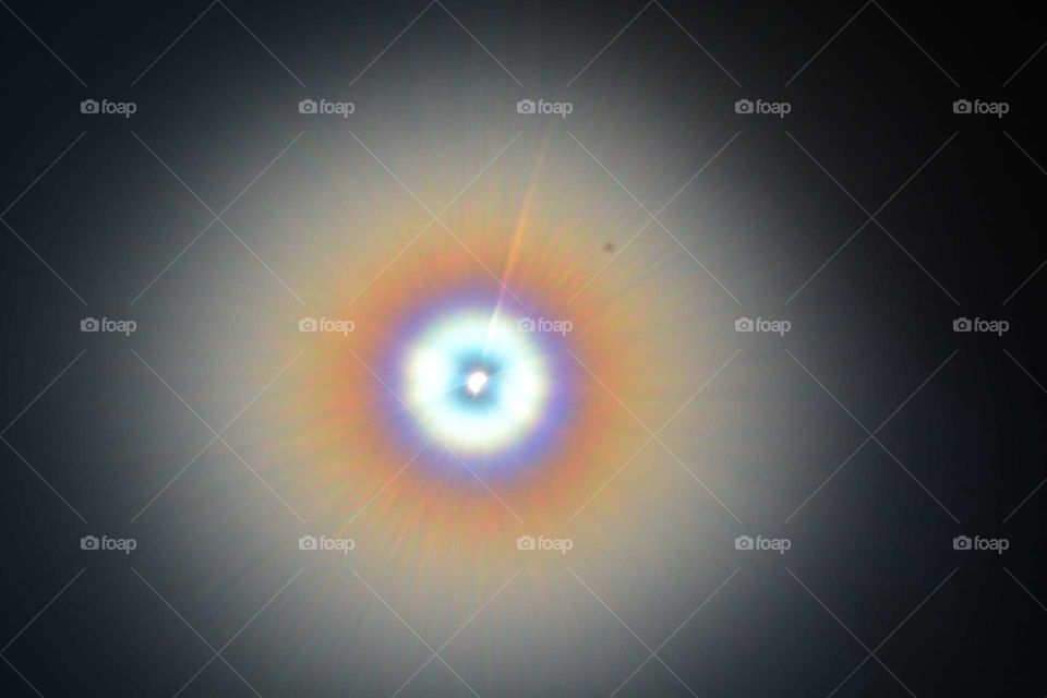 Eclipse and a hazy lens