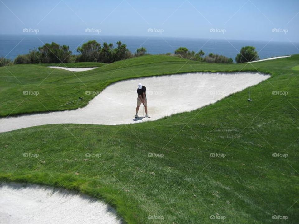 Golfer in sand trap