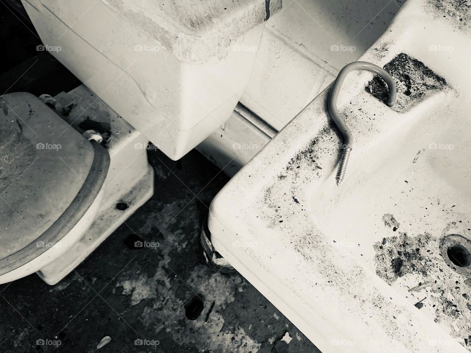 Abandoned And Needing To Be Restored Bathroom With Rusted And Destroyed Elements. 