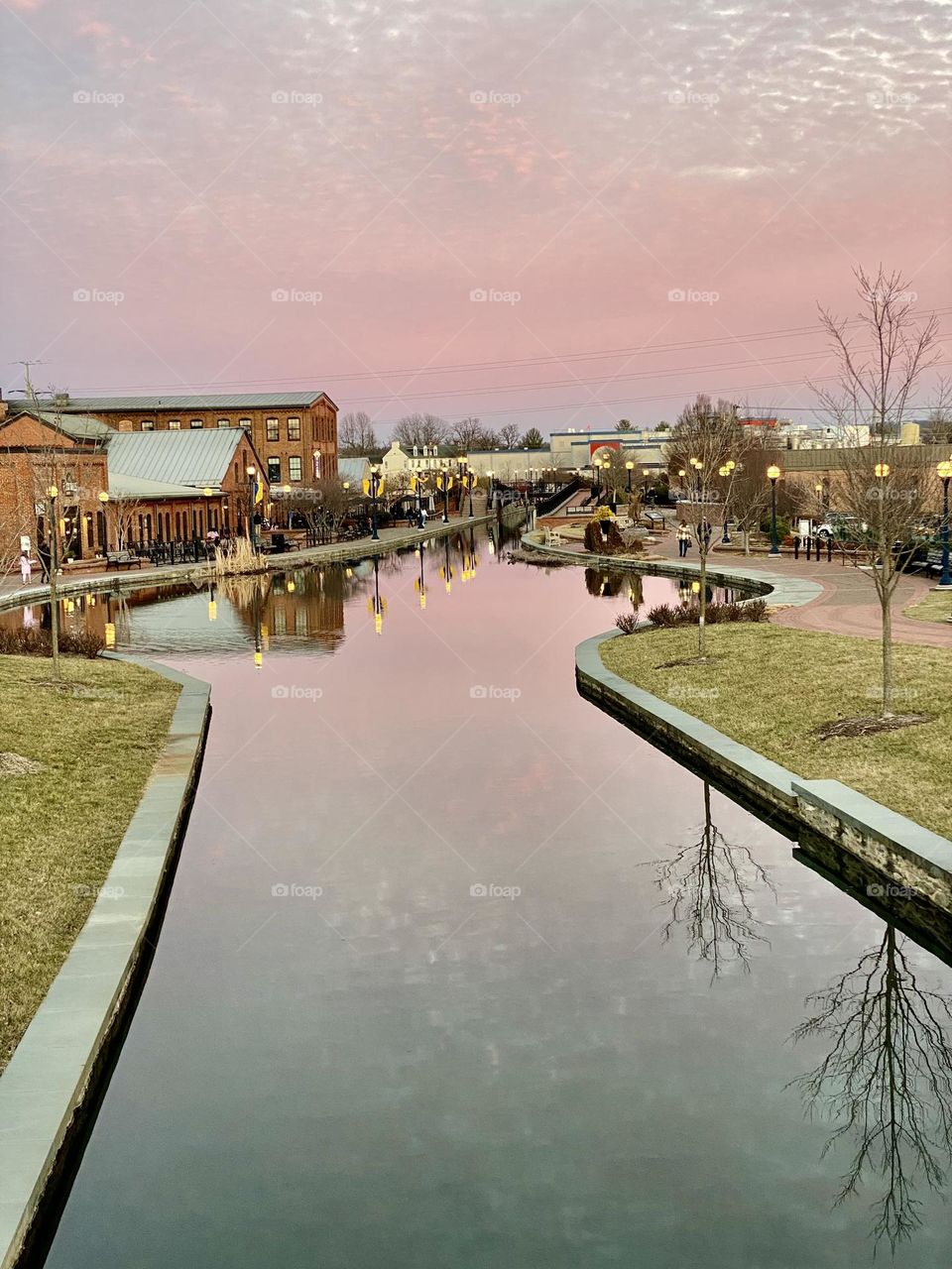 Reflections in the water at sunset on Carroll Creek in Frederick Maryland 