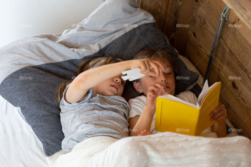 Brother and the sister are exploring happyself journal together.