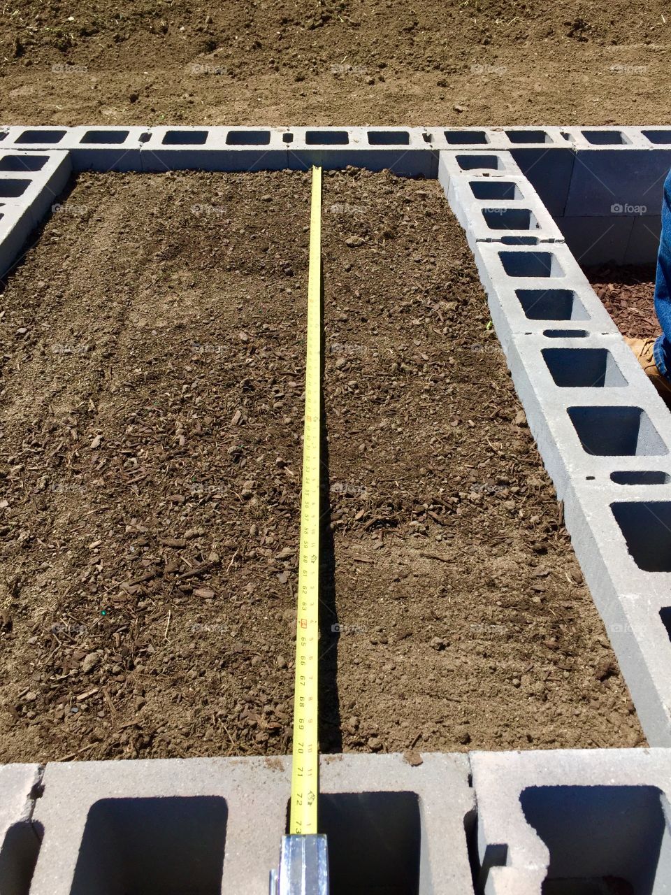 Measuring for seed-spacing in a raised garden bed