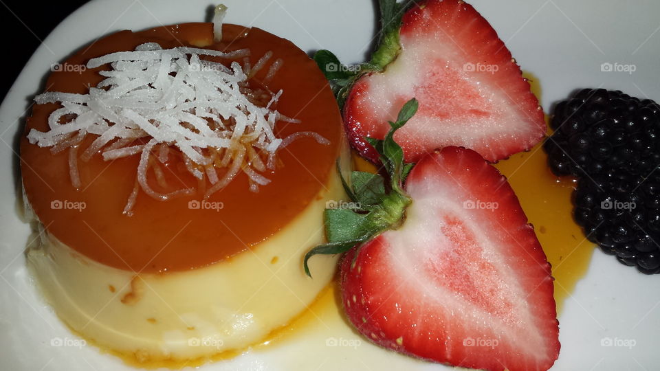 coconut  flan. yummy dessert  with fruit