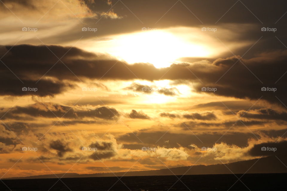 Some sunrise shots of the sky over the ocean on a windy Pacific Northwest morning. There were some clouds but the sun shone through creating beautiful colour in the sky and sea.