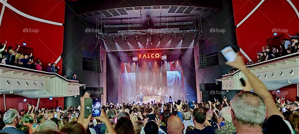 The theater lights are on now to signal to the crowd that it’s time to file out at the “DEUTSCHES THEATER”, the “GERMAN THEATER” in “Munich”, Bavaria where “FALCO” has been shown, a play about the famous singer from Vienna. 2024. Hypnotic Productions