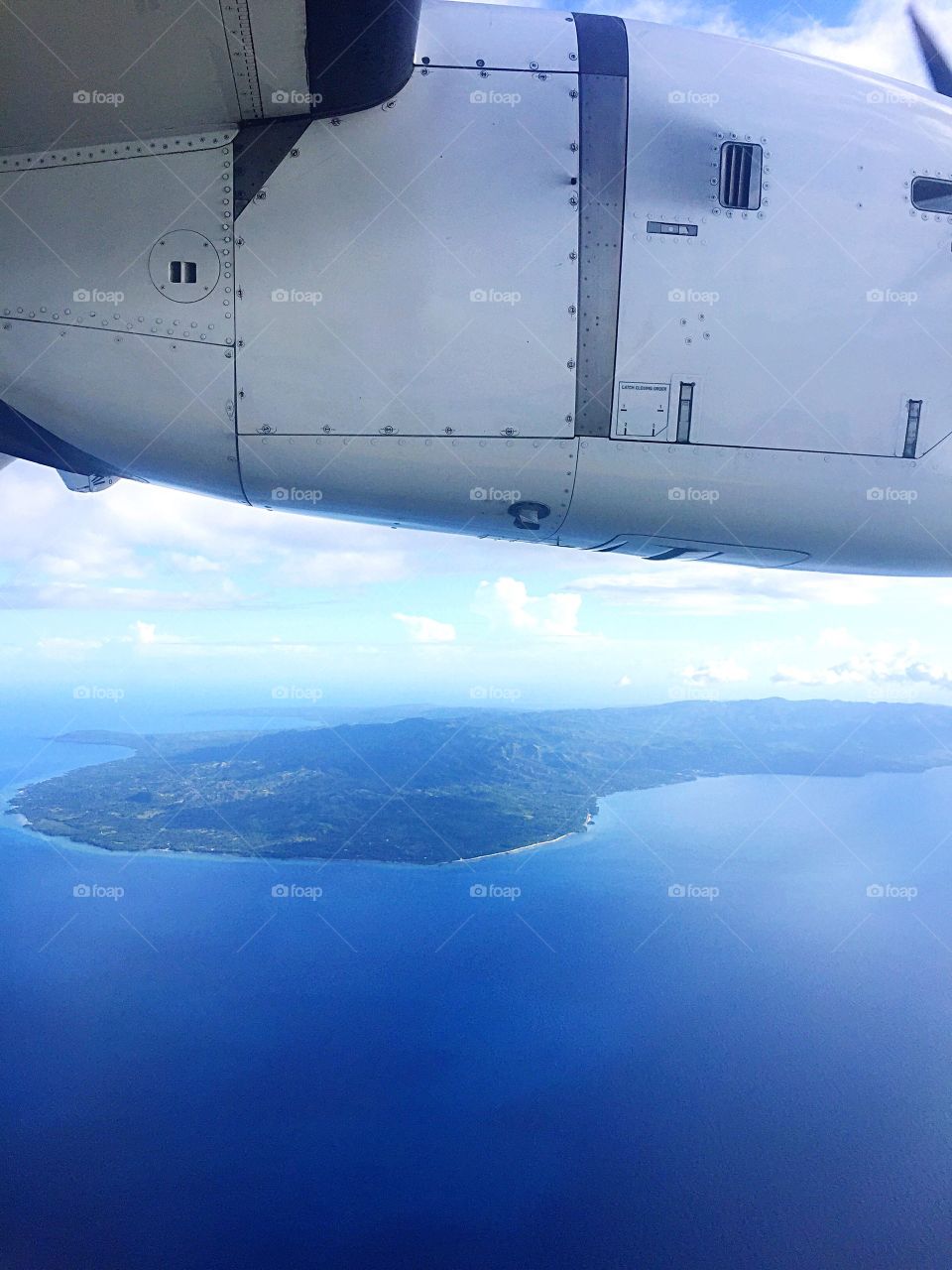 Island view from a plane window in the Philippines 