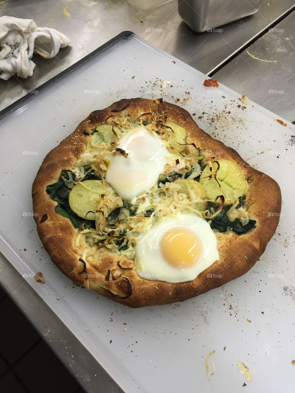 Breakfast pizza with potato, onion, and egg. It's like a pizza meets a frittata
