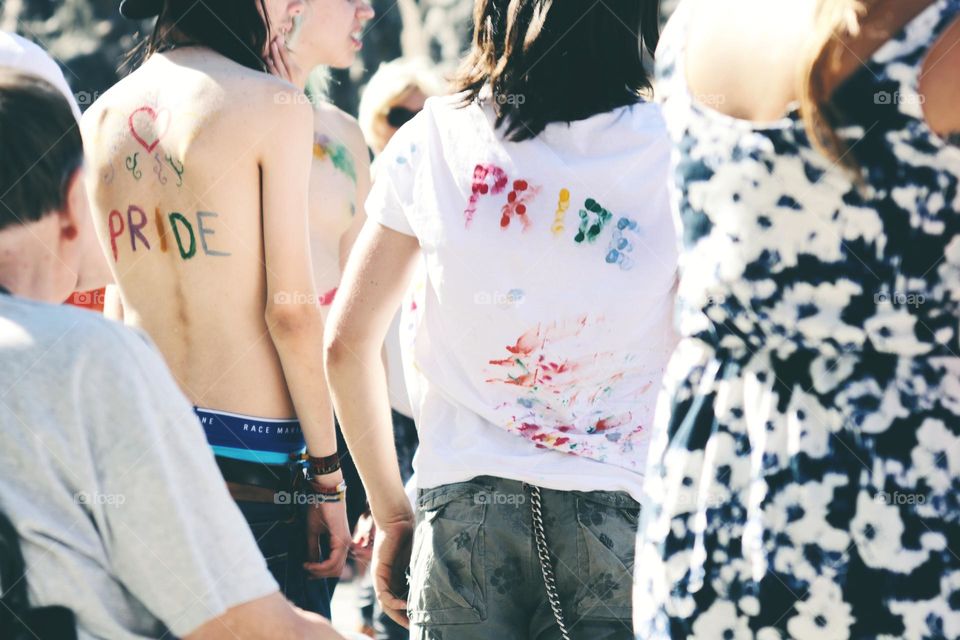 People from behind wearing a pride T-shirt 