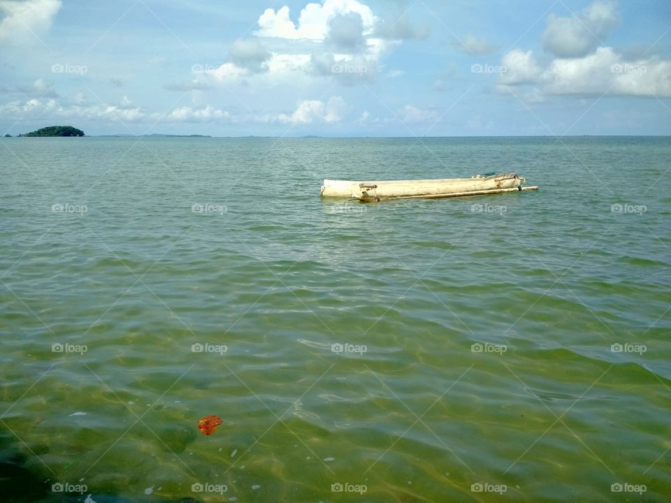 Stranded boat near the tiny island