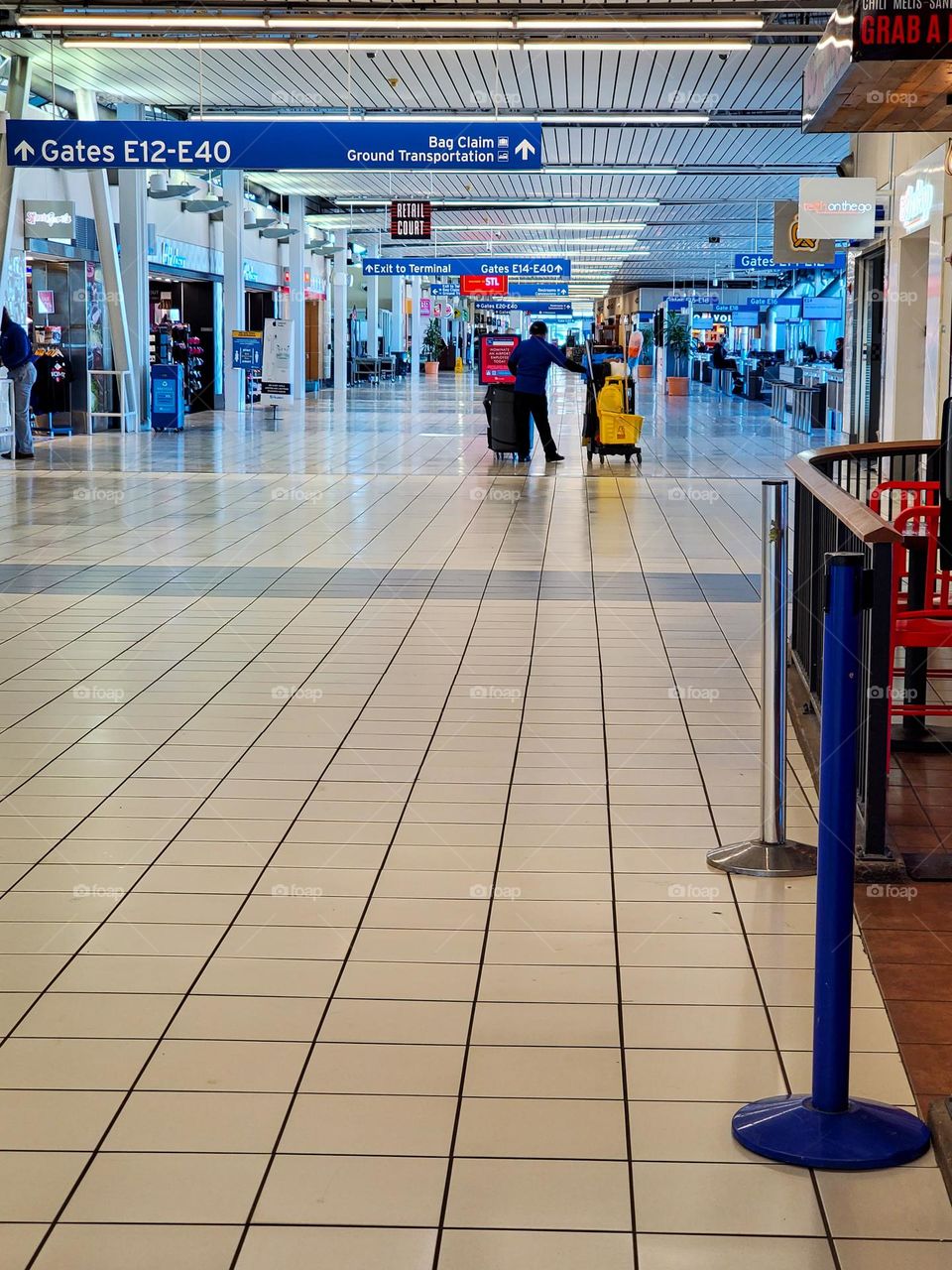 With the omicron variant of Covid-19 raging, an American airport is virtually deserted as people resist traveling