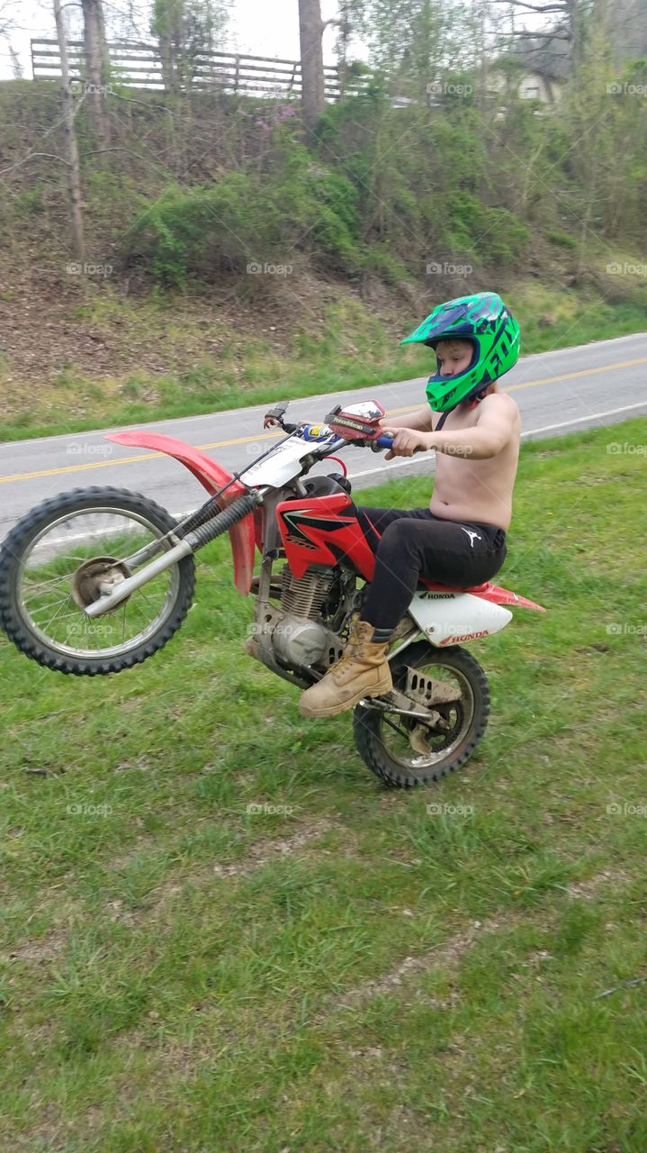 Riding wheelie on motorcycle