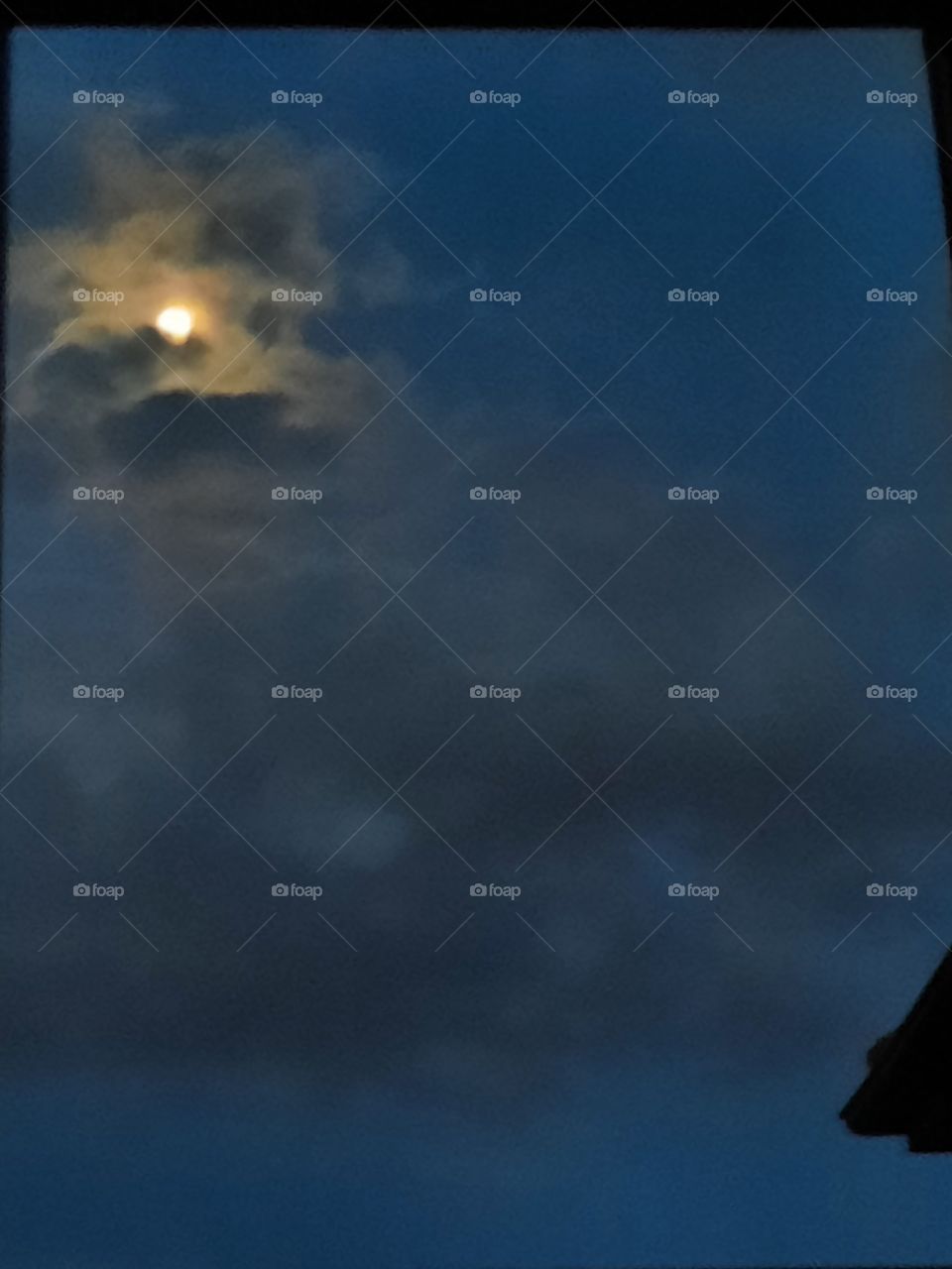 window vue of moon and clouds  at summer night