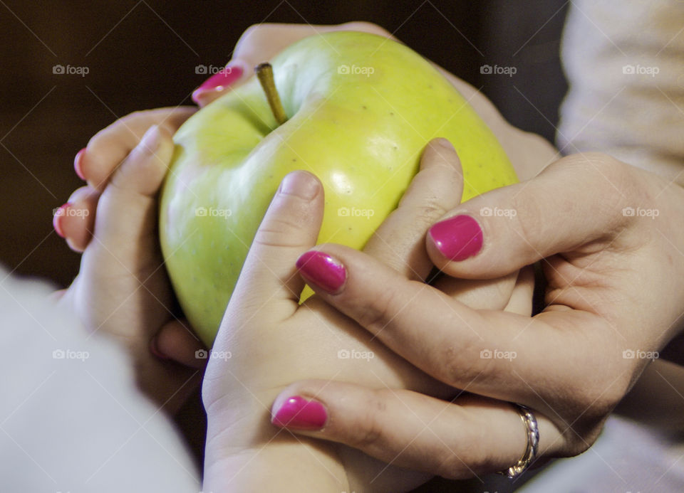 Person holding apple